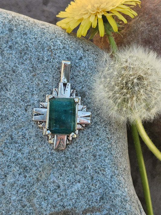 Silver Zia pendent with emerald.